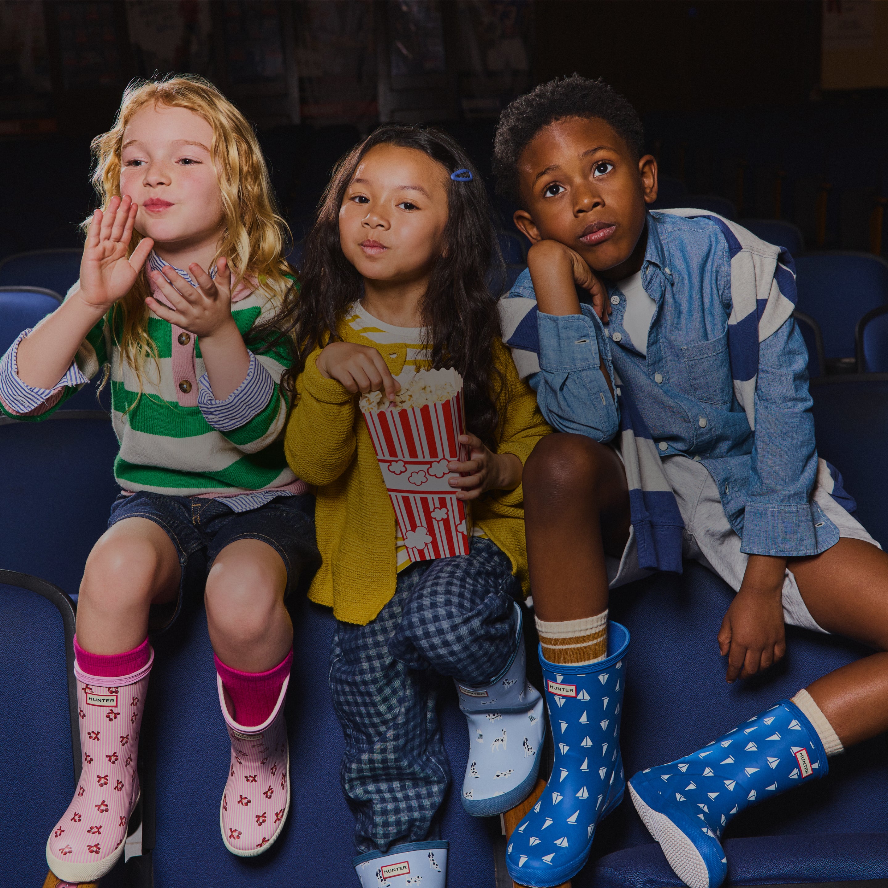 Promotional banner featuring kids' printed rain boots