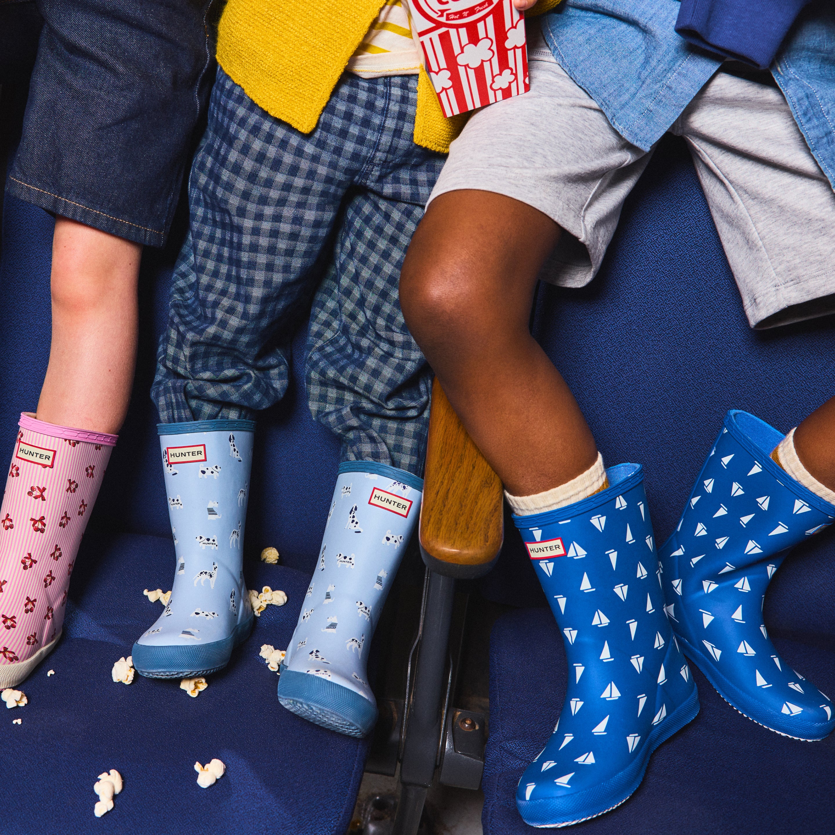 Promotional banner featuring kids' printed rain boots