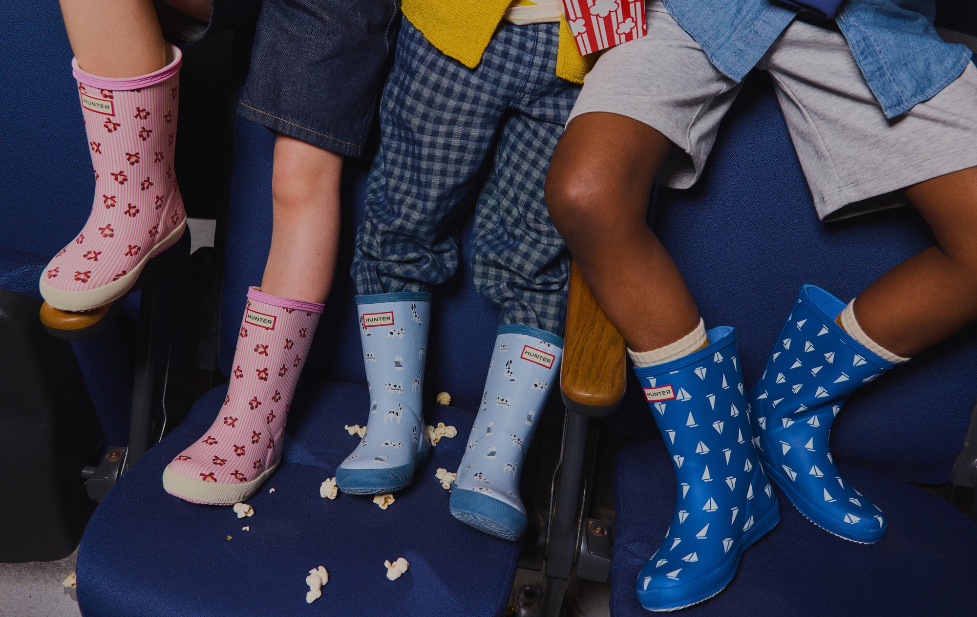 Promotional banner featuring kids' printed rain boots