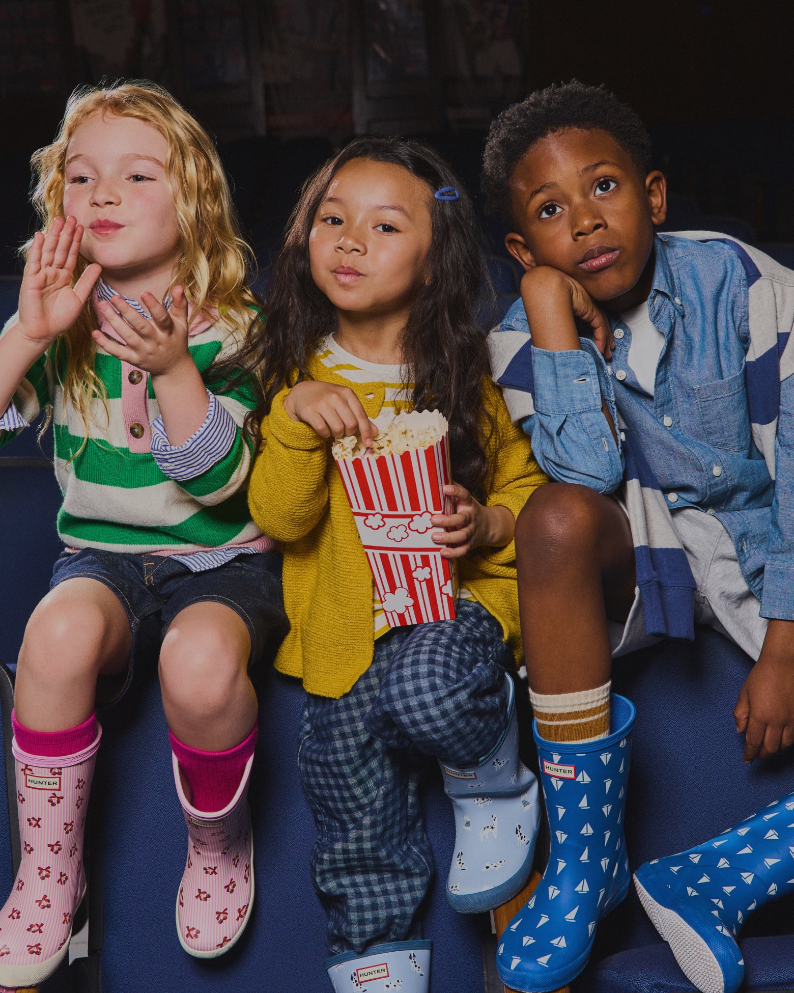 Promotional banner featuring kids' printed rain boots